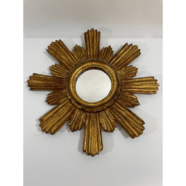A stunning 14.5" Italian Giltwood Sunburst Wall Mirror from circa 1950s. Retains original backing and hanging hardware....