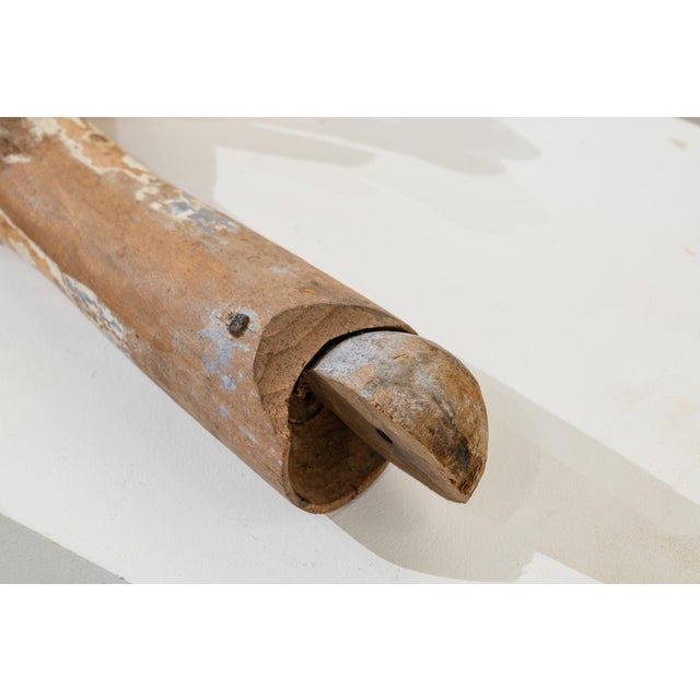 A pair of life-size forearms, carved from wood, originally part of a 19th-century religious processional image. Executed...