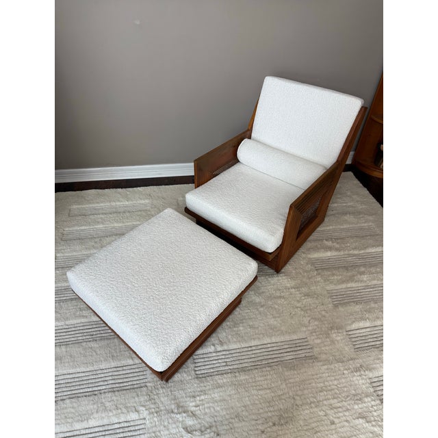 Very unique and likely one-of-a-kind cane chair and ottoman with bamboo or rattan style carved wood. Freshly reupholstered...