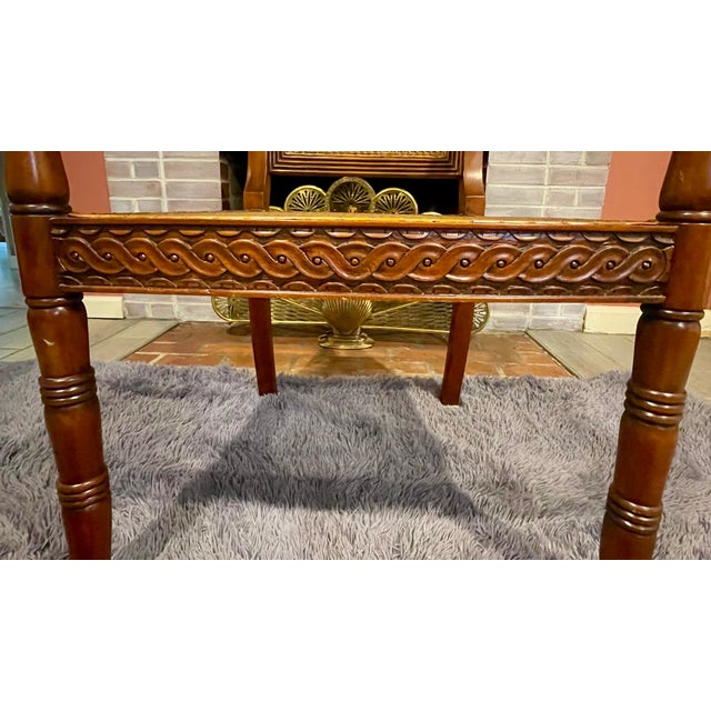 This striking vintage Regency-style armchair masterfully blends classic British colonial influences with mid-to-late 20th-...