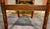 This striking vintage Regency-style armchair masterfully blends classic British colonial influences with mid-to-late 20th-...
