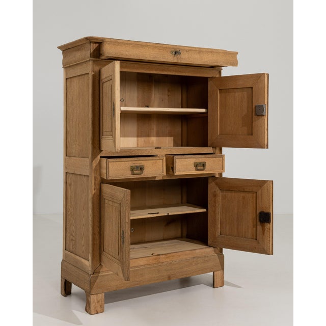 Crafted in France during the nineteenth century, this handsome oak cabinet exemplifies the Louis Philippe style in its...