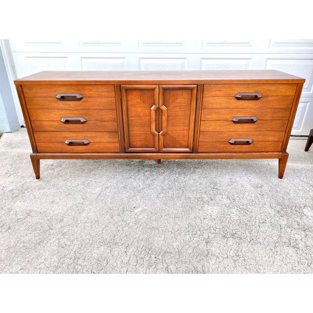 1960s Basic Witz Mid Century Modern 9 Drawer Dresser Chairish English dovetailed drawers open smoothly on waxed wood glides and feature drawer stops for safety. chairish