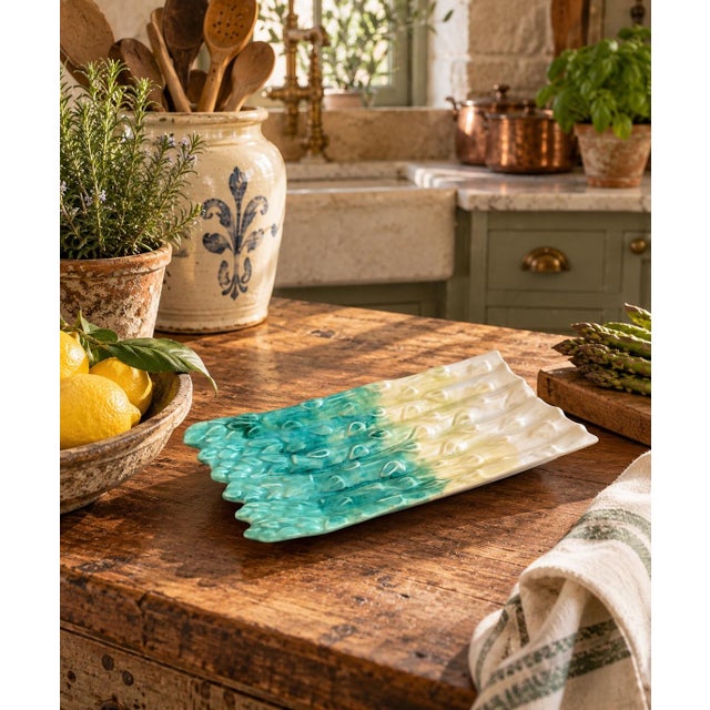A charming vintage majolica ceramic asparagus dish dating to the late 20th century, beautifully modeled in the form of a...