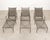 A refined set of three matching wrought iron chaise lounges or longues crafted in the mid-century modern manner and style...