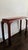 Elegant mahogany console table. A unique yet timeless design featuring curved chow legs, giving it a traditional, asian-...