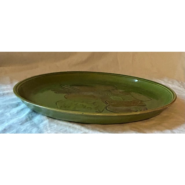 Chic Avocado green 14" round platter depicting 4 French cheeses and bread by California based Los Angeles Potteries....