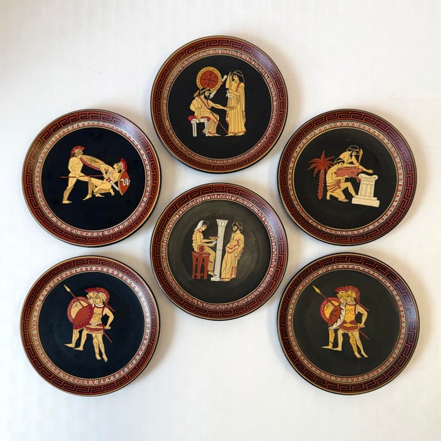 A wonderful collection of 6 decorated terracotta plates, hand painted and made in Greece. Each plate features a replicated...