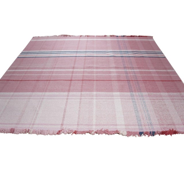 A handwoven wool flatweave, made in India and measuring 6' x 9'. Flatweaves carry no pile, so the geometry sits flush...