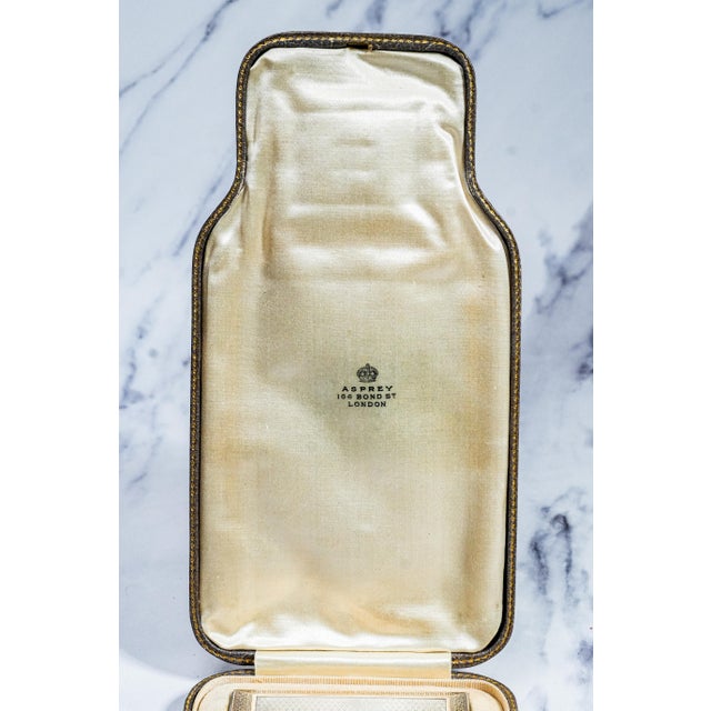 This exceptional English engine-turned sterling silver vesta case and cigarette case set by Asprey of London represents...