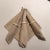 4 soft dove grey dinner napkins, mid-century, including (no charge) 3 white plastic napkin rings. These rings demonstrate...