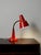Scandinavian table lamp by Gemi in red lacquered metal, with a flexible, adjustable neck and perforated shade. Table lamp...