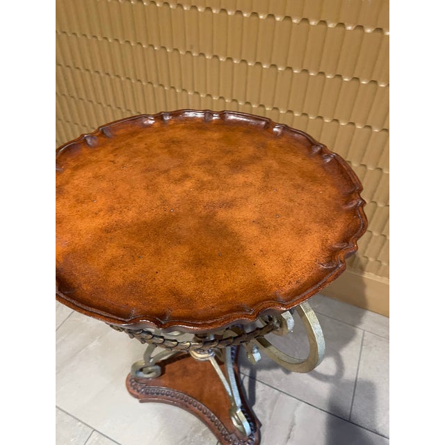 Add a touch of Parisian elegance to your interior with this striking French-style Louis XV Revival accent table. The piece...