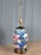 Beautiful table lamp with hand painted floral porcelain, brass trim, wood top and base. Retains Frederick Cooper sticker...