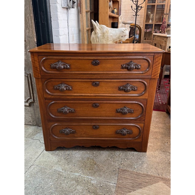 Beautiful late 19th-century Eastlake dresser dating to the 1880s, featuring four drawers, classic molded panel fronts, and...