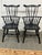 Design Plus Gallery presents a Pair of Vintage Tall-Back Windsor Armchairs from Nichols & Stone. Constructed from wood in...