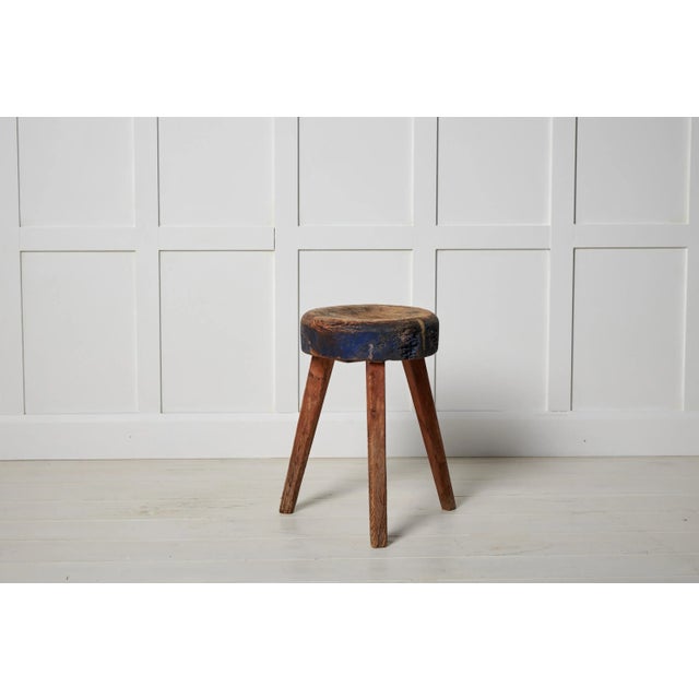 Antique Swedish country stool made in northern Sweden around the mid 1800s. The stool is made by hand from solid pine. It...