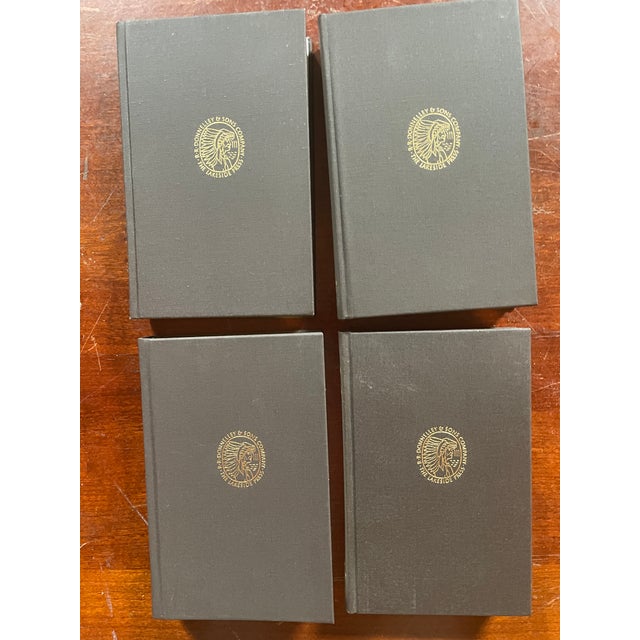 Set of four R.R. Donnelley Lakeside Press vintage books. Beautiful dark brown cloth bound with gilding on the spline and...