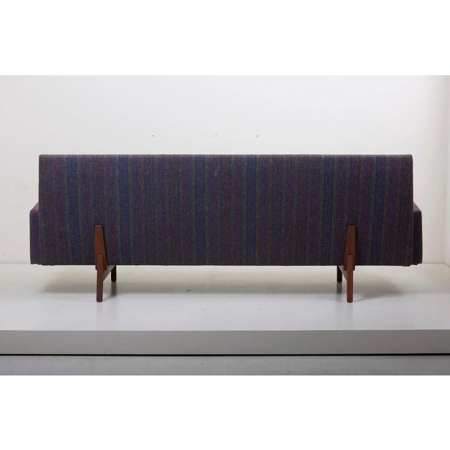 This Jens Risom sofa for Risom Design Inc. is in good condition. The solid walnut frame has been oiled and is in vintage...