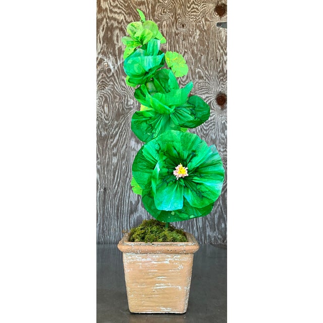 Contemporary hand-rolled paper flowers are a modern, artistic take on traditional floral arrangements. These flowers are...