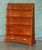 Beautiful matching pair of mahogany dwarf open library bookcases, designed in the elegant Regency tradition with graduated...