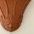 This beautiful neo-classical terracotta wall pocket features a pretty sculpted face with closed eyes set beneath a...