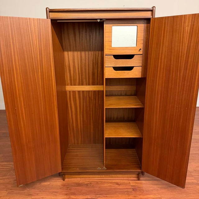 Vintage mid-century wardrobe/armoire made in the U.K. by White & Newton circa 1960's, ideal for use as a standalone closet...