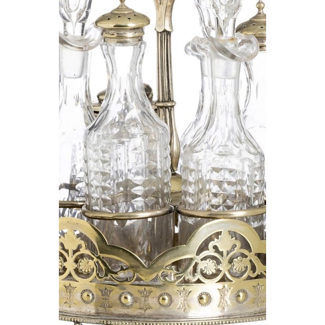 Victorian cruet set in 19th-century English veneer; composed of a base with embossed and openwork decoration in 19th-...