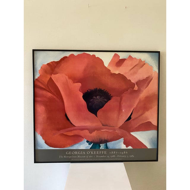A colorful original exhibition poster advertising the work of Georgia O'Keeffe at the Metropolitan Museum of Art, New...