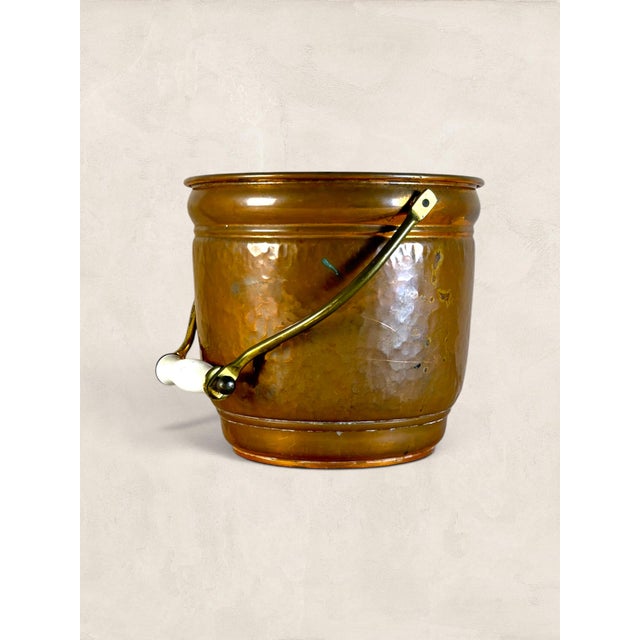 Antique English hammered copper planter catches light in a way that is difficult to explain until you see it in a room....