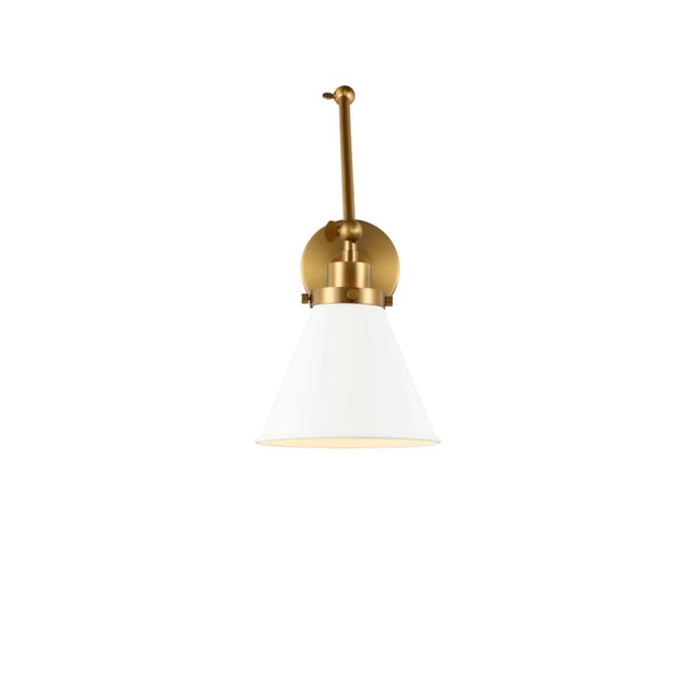 Inspired by various classic utility silhouettes - from factory lighting to barn sconces - capped by contrasting metal...