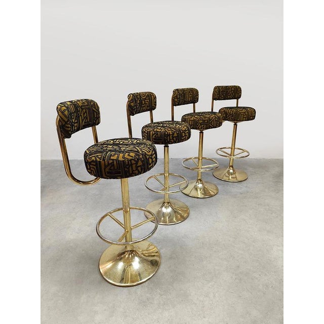 Glam and luxurious, these four unique vintage design Cobra bar stools by Borje Johanson are real conversation starters....