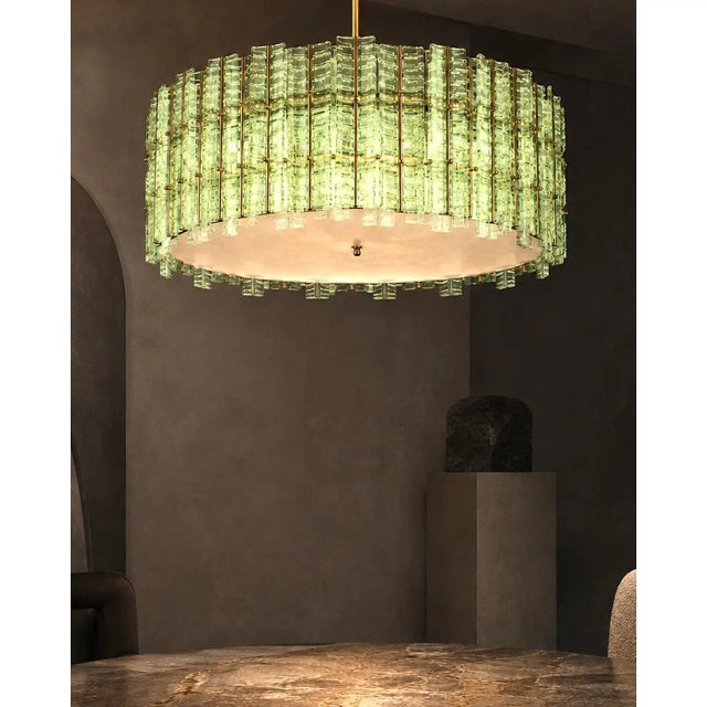 Contemporary gold chandelier in Murano Glass full of leaves that give a touch of “tropical” design. Extremally elegant and...
