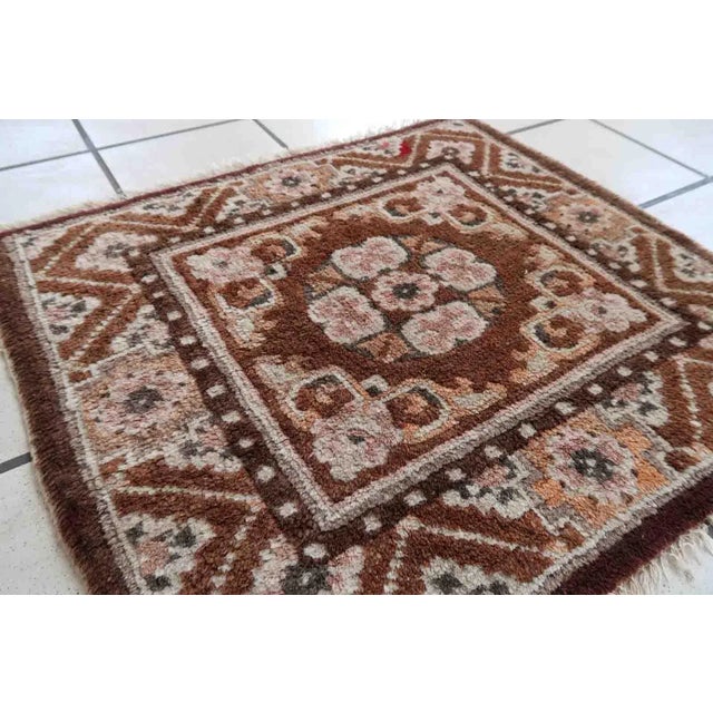 Handmade vintage Mongolian collectible mat in brown shade. The rug is from the middle of 20th century in original good...