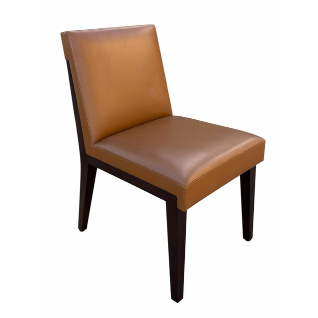 Set of 8 Holly Hunt Walnut & Leather Dining Chairs. Upholstered in cognac leather and signed to the undersides.