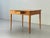 This biedermeier table impresses with its minimalist design and the warm, inviting tone of the solid cherry wood. The...