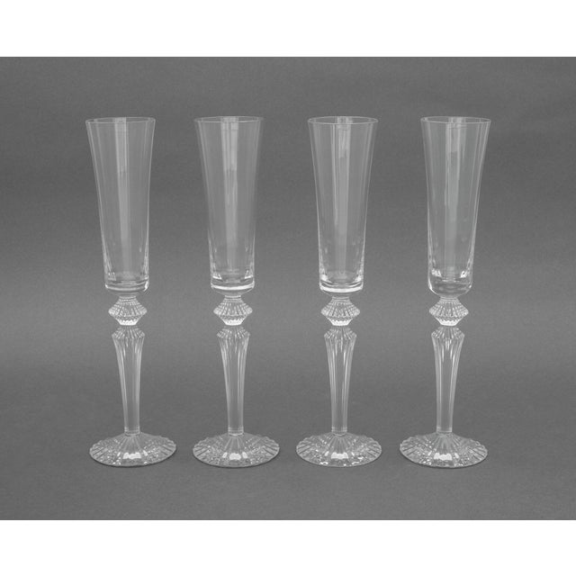 Set of Four Baccarat Crystal "Mille Nuits Flutissimo" Pattern Champagne Flutes, each marked to underside. 11.75" H x 3"...