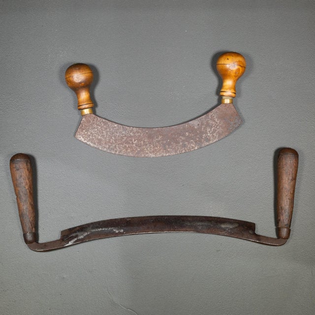 ABOUT Antique 12 inch draw knife with wooden handles and one mezzaluna knife with Beech handles. Brass collars. CREATOR...