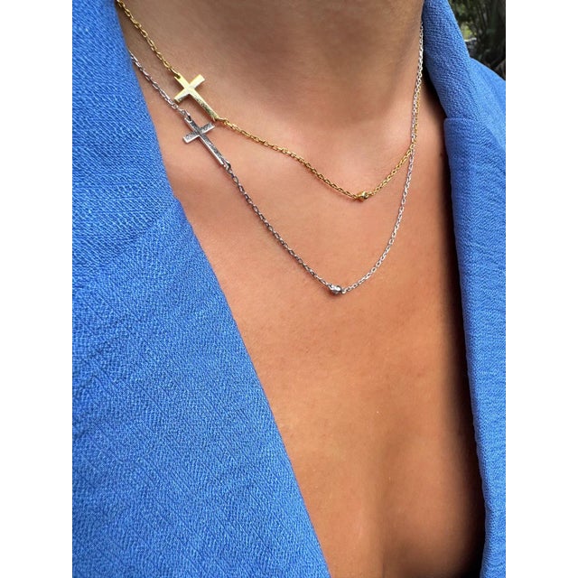 Discover the elegance and meaning of our Sterling Silver Cross Charm & Diamond Chain Necklace, a beautifully crafted piece...