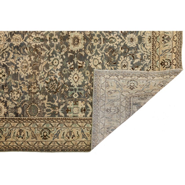 Elevate your interior with this magnificent Antique Oriental Wool Rug, showcasing a stunningly preserved allover floral-...