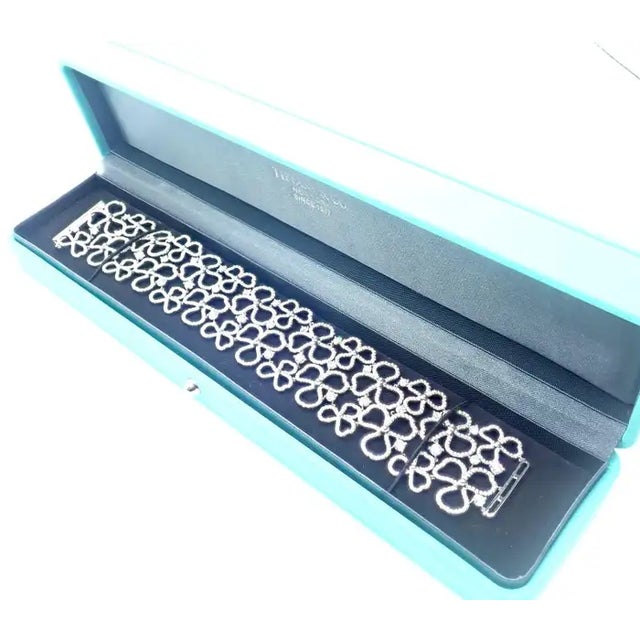 This is part of Chairish’s Fine Jewelry assortment. Platinum Diamond Paper Flowers Wide Bracelet by Tiffany & Co. With...