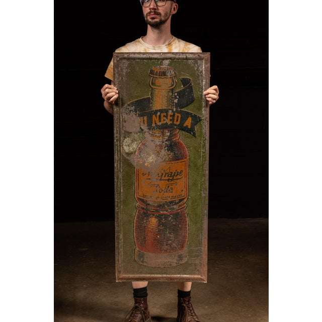 c. 1920s; National NuGrape Co. - Atlanta Antique painted tin soft drink advertising sign. This sign advertises NuGrape, a...
