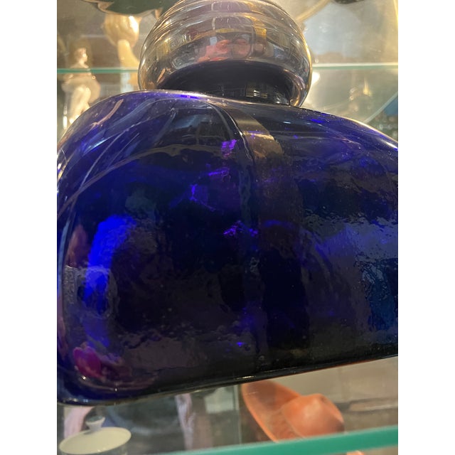 Up for consideration is a beautiful French blue glass bottle with a silver lid. This would look lovely in your home and it...