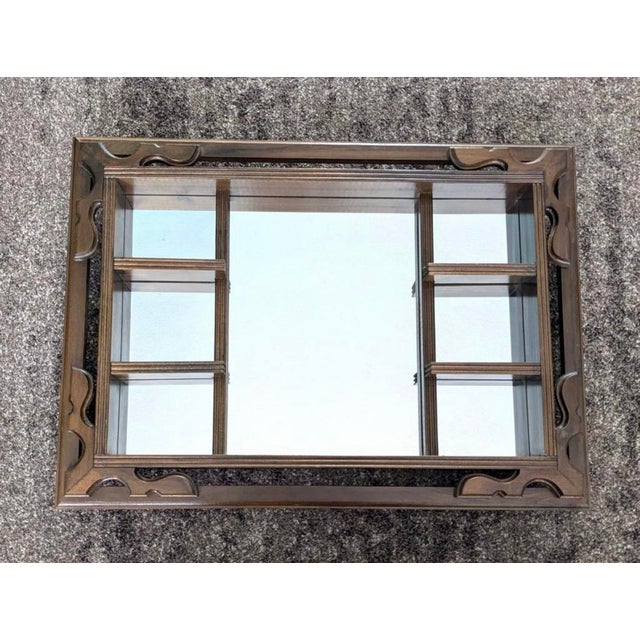 1950’s Mid Century Modern Wall mounted Shadow Box. Is specifically slotted to slide in a mirror, or glass for more of a...