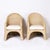 Mid century inspired armchairs crafted in wicker or reed ambitiously woven over a sturdy metal frame in a ghost drapery...