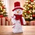 Add a sweet touch of holiday magic to your home with this Plush Snowman Figurine with Candy Cane and Red Hat. Featuring a...