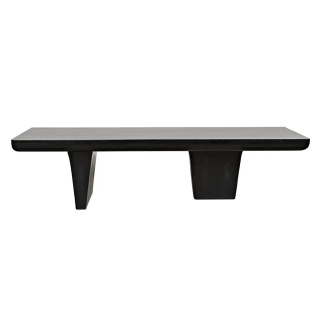 The Ward coffee table features a simple rectangular top with subtly rounded underside edges, and two opposing rudder shape...