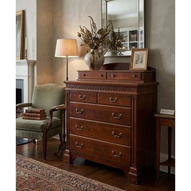 A distinctive vintage tall chest of drawers by Lane Furniture of Altavista, Virginia, combining generous storage with...