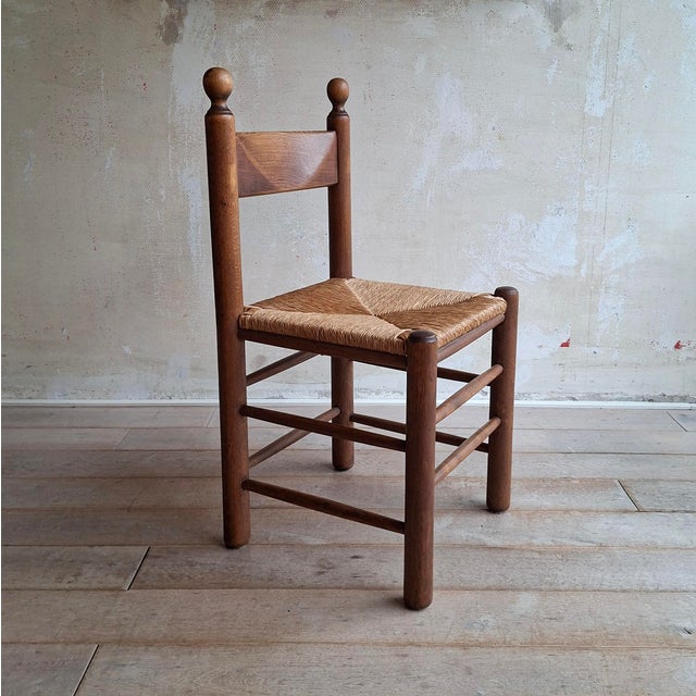 Sturdy 1970s oak brutalist chairs with rush seats. Weight: approx. 8 kg each.