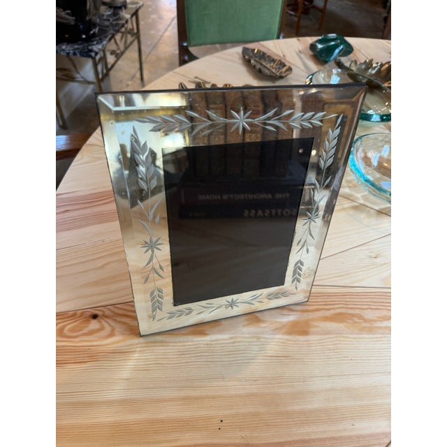 A vintage Italian picture frame crafted from thick clear glass, beautifully decorated with hand-etched floral and foliate...